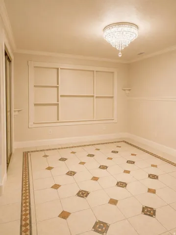 Detailed tile flooring with decorative border and inserts