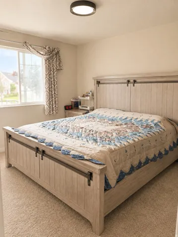 Neutral wall paint, carpet flooring, a flush-mount ceiling light fixture, and a window with trim