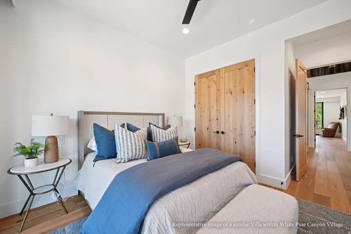 White walls with a black ceiling fan