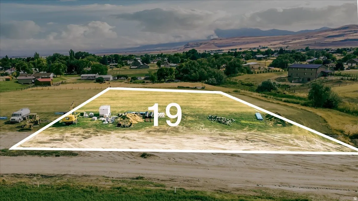 Expansive lot outlined with a clear boundary, featuring a level, grassy area