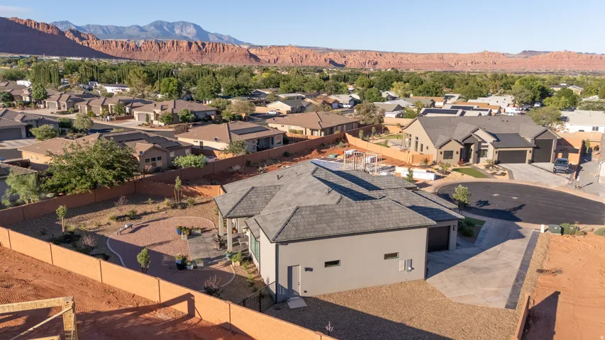 Contemporary residence with a multi-gabled roofline, attached garage, and a concrete driveway