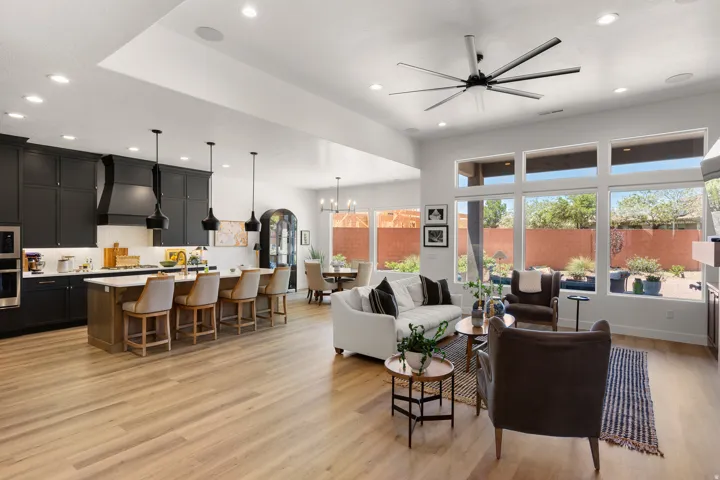 Open-concept living space featuring wood-finish flooring and recessed lighting
