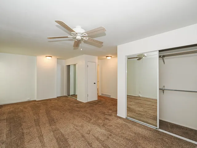 Brown carpet flooring with white walls