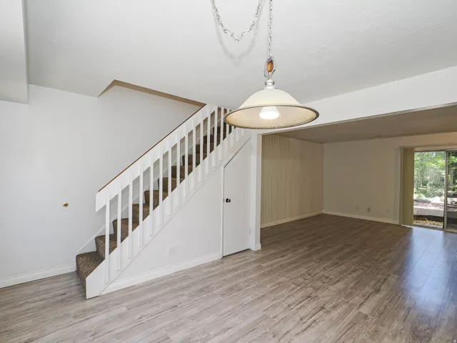 White baluster staircase with carpeted treads