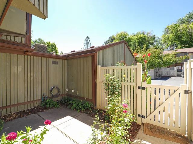 Private patio area with concrete paving and vertical siding