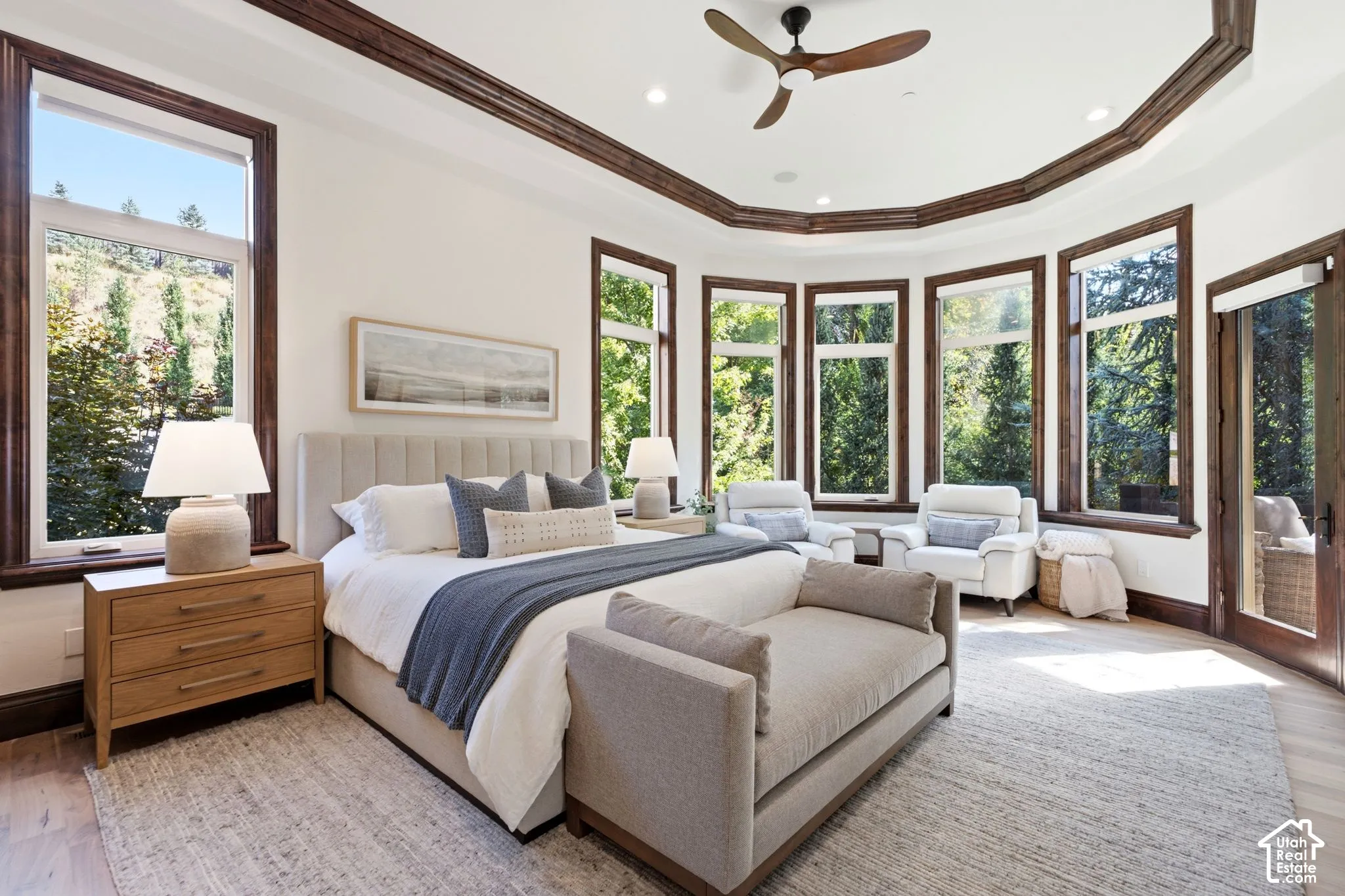 Recessed lighting, wood-finish flooring, and a ceiling fan