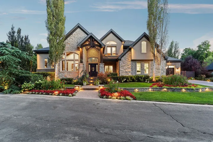 Stone and stucco exterior with multiple gables