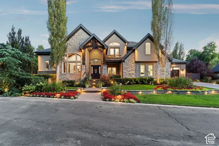 Stone and stucco exterior with multiple gables