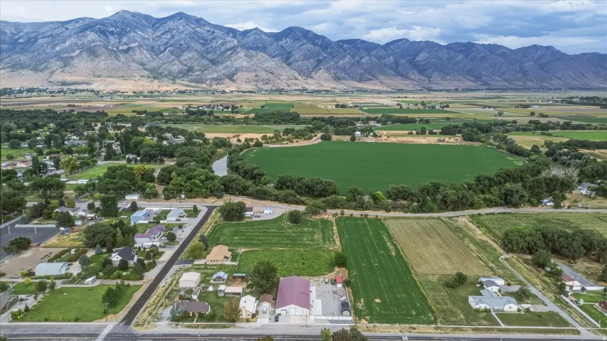 Expansive valley setting with mountainous backdrop