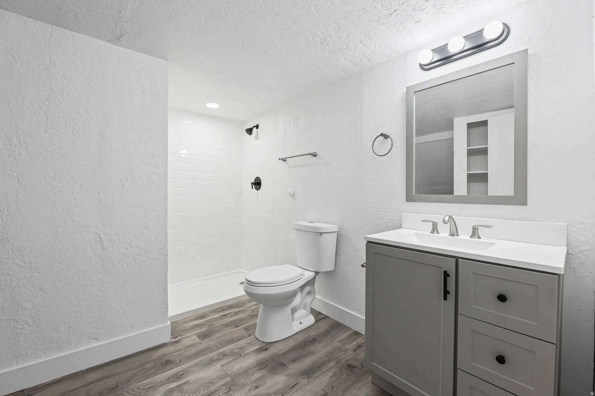 Updated Basement Bathroom with New Shower Enclosure