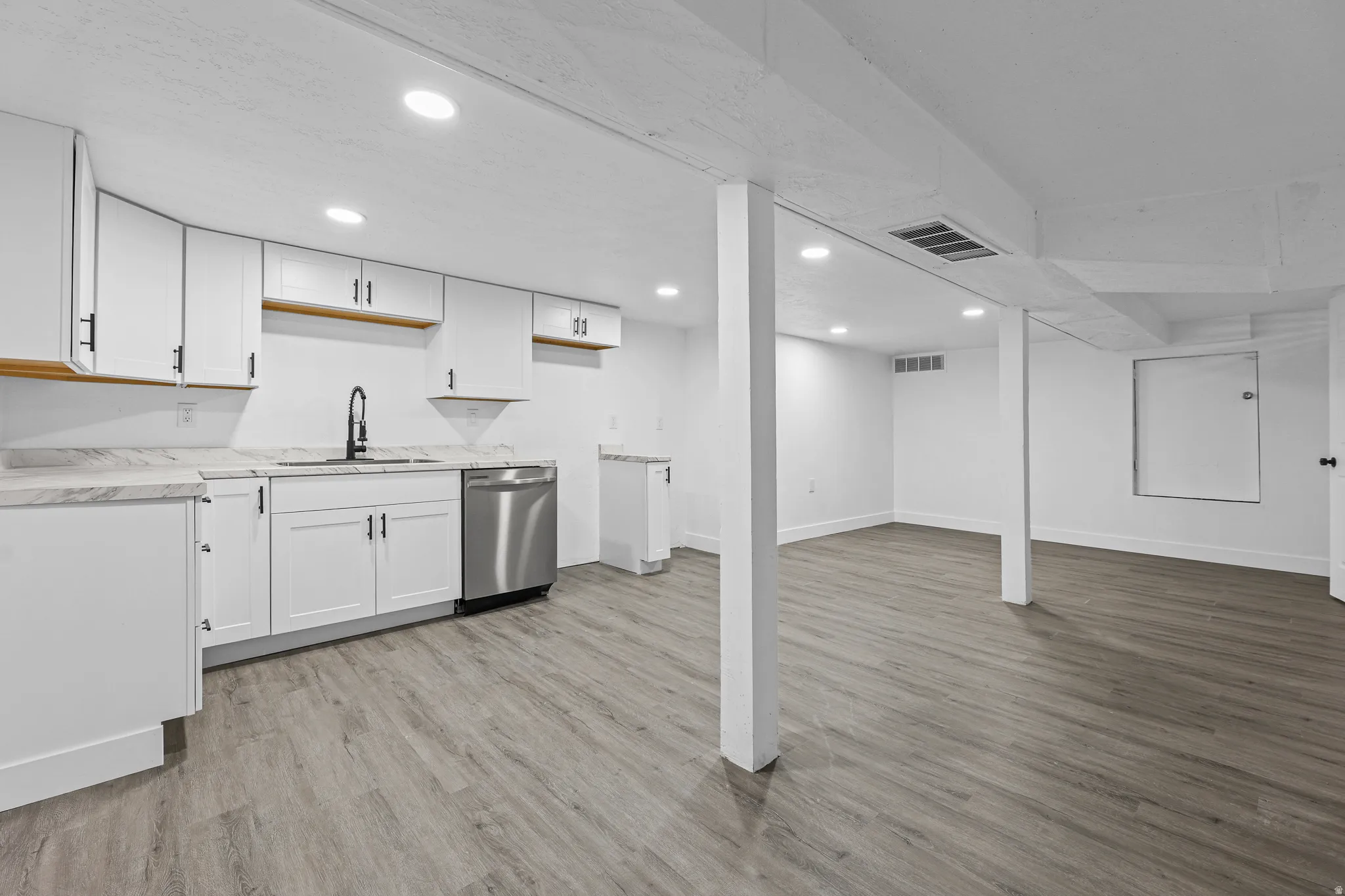 Open Basement Kitchen with New Cabinets & Stainless Appliances with Dining Area