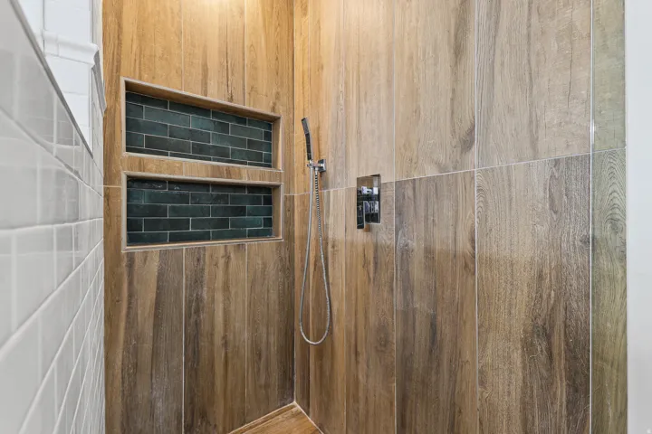 Primary Bathroom Shower with Updated Tile and New Euro Glass Enclosure