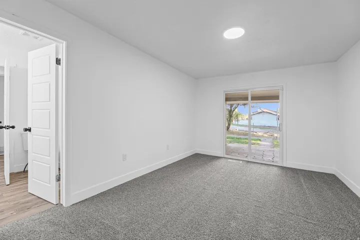 Bedroom #3 with Access to the Main Bathroom & Sliding Doors to the Back Patio