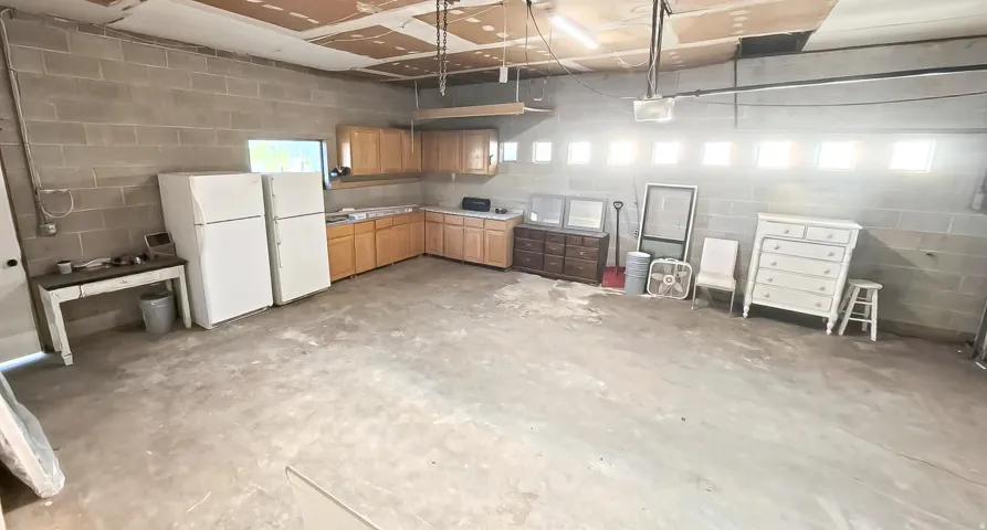 Oversized Garage with Door to BackYard and Lots of Windows for Natural Light