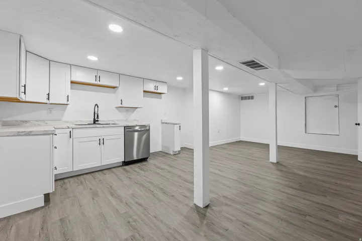 Open Basement Kitchen with New Cabinets & Stainless Appliances with Dining Area