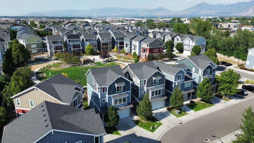 Aerial perspective showcasing a residential development with varied exterior siding and multiple rooflines