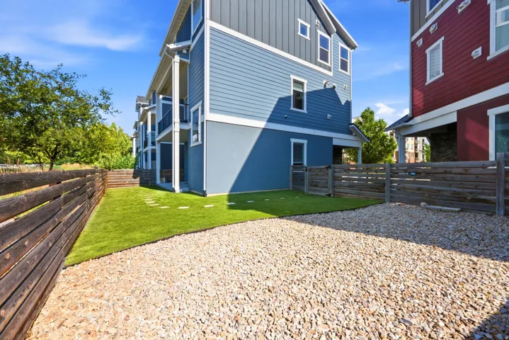 Multi-level exterior with blue siding and white trim