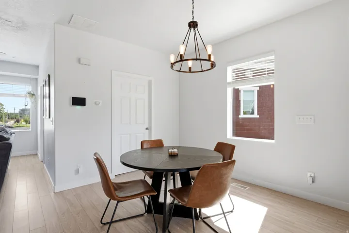 Wood-finish flooring with crisp white walls and trim
