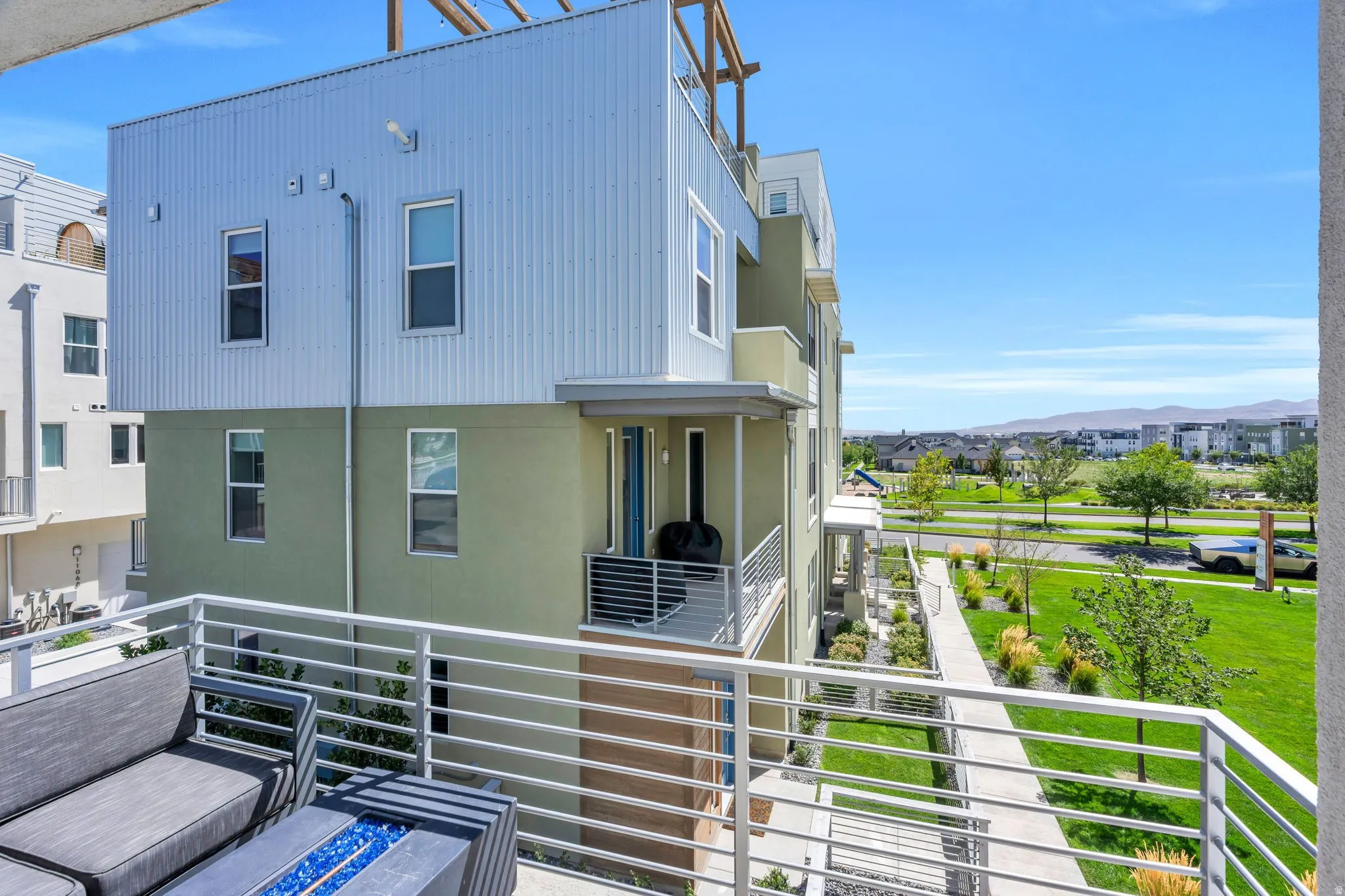 Multi-level contemporary exterior with metal siding and stucco finishes