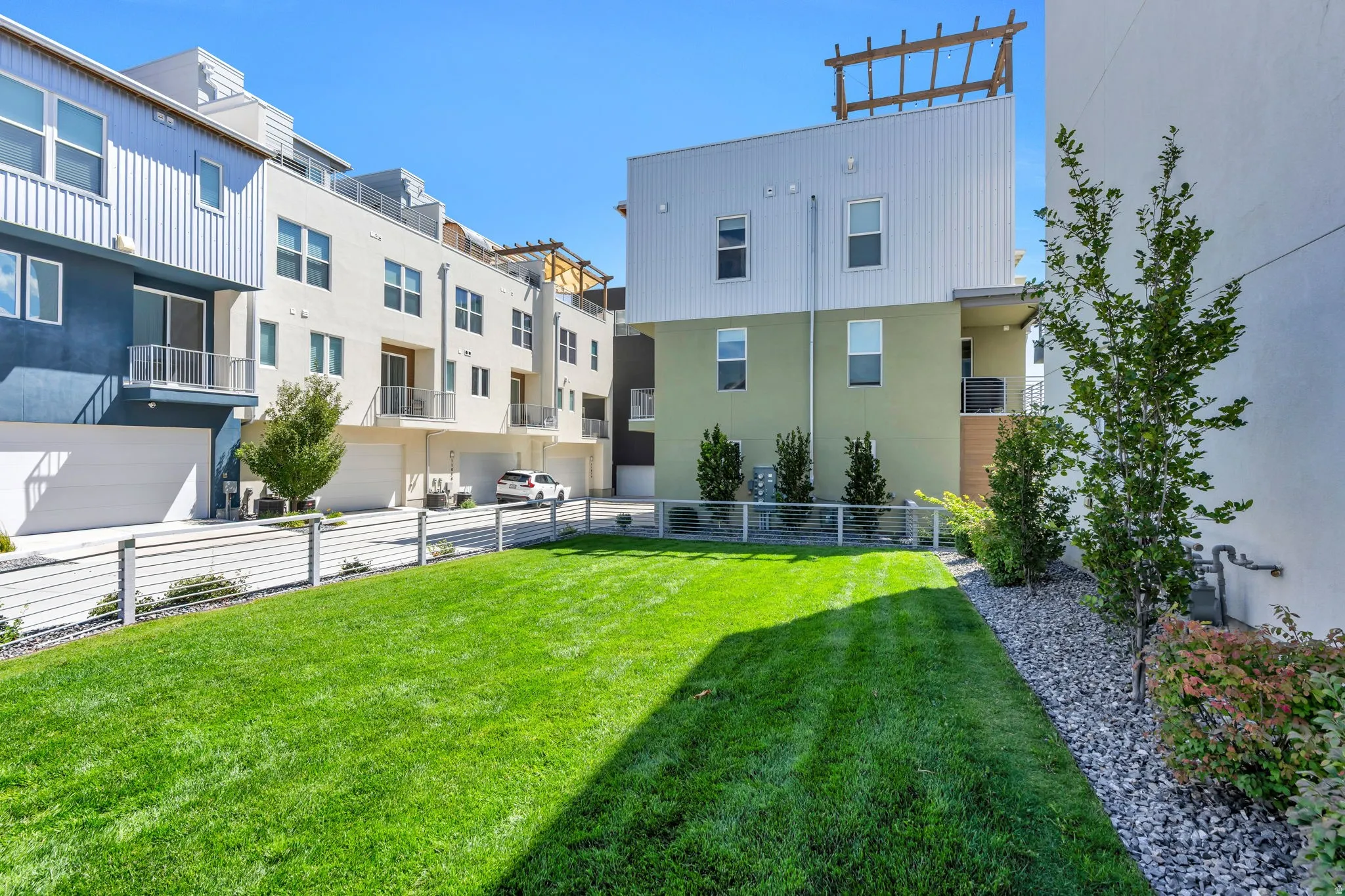 Manicured lawn with a low-profile cable railing