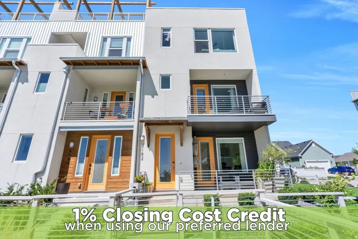 Modern multi-story exterior with white stucco siding and wood-finish accents