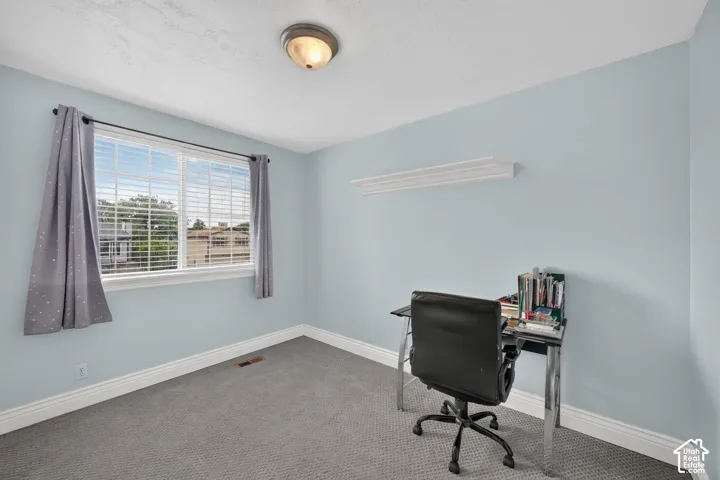 Light blue painted walls with white trim and a single window