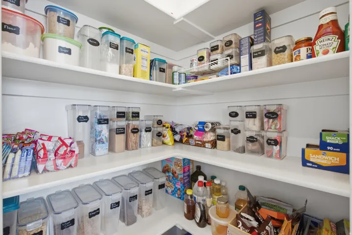 Corner pantry with white shelving