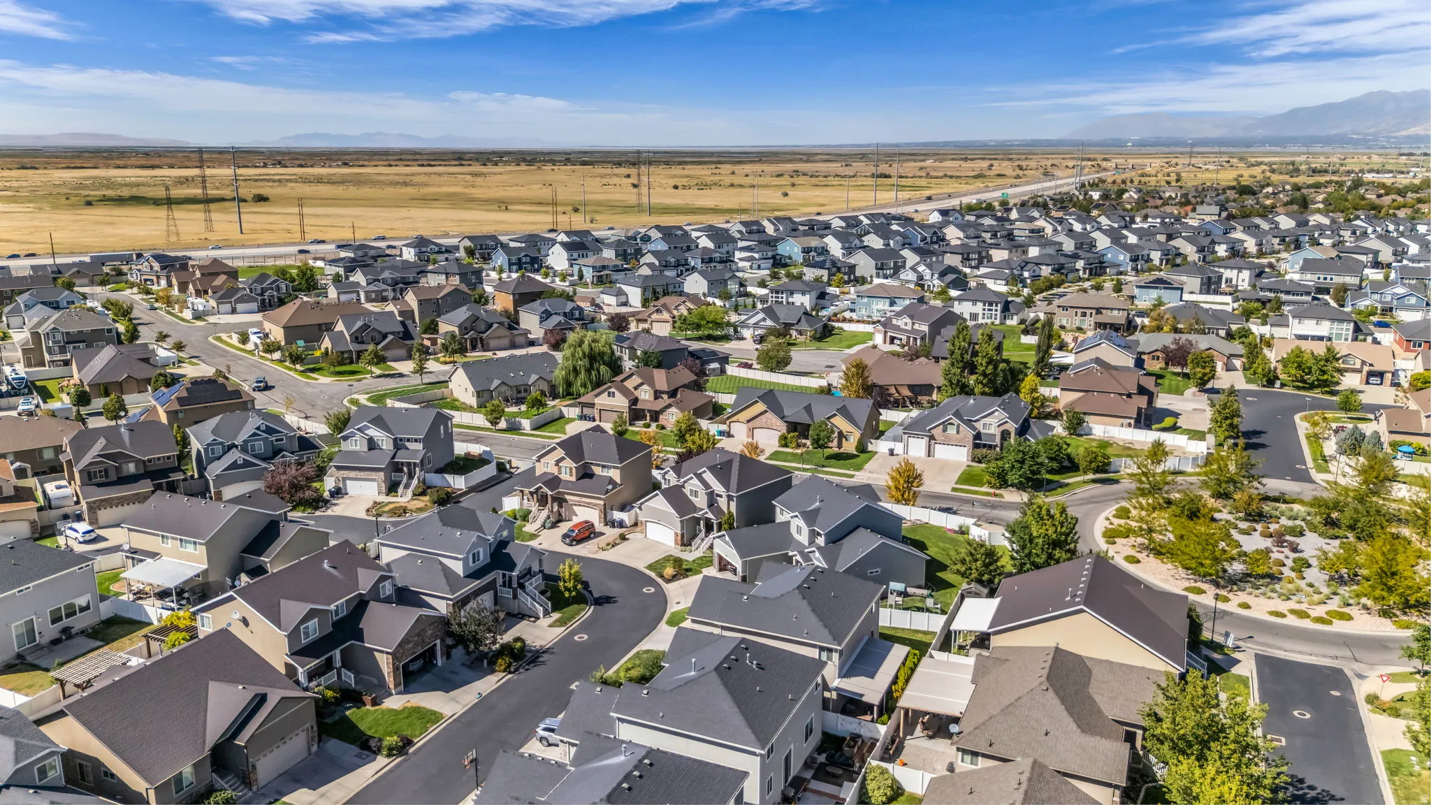 Residential neighborhood featuring diverse architectural styles and paved streets