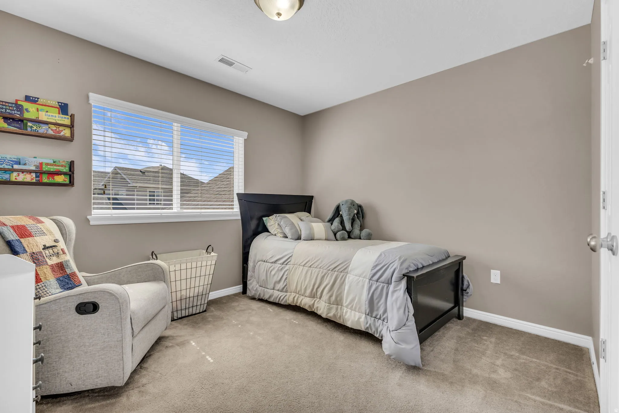 Window with horizontal blinds, neutral wall paint, and ceiling-mounted light fixture