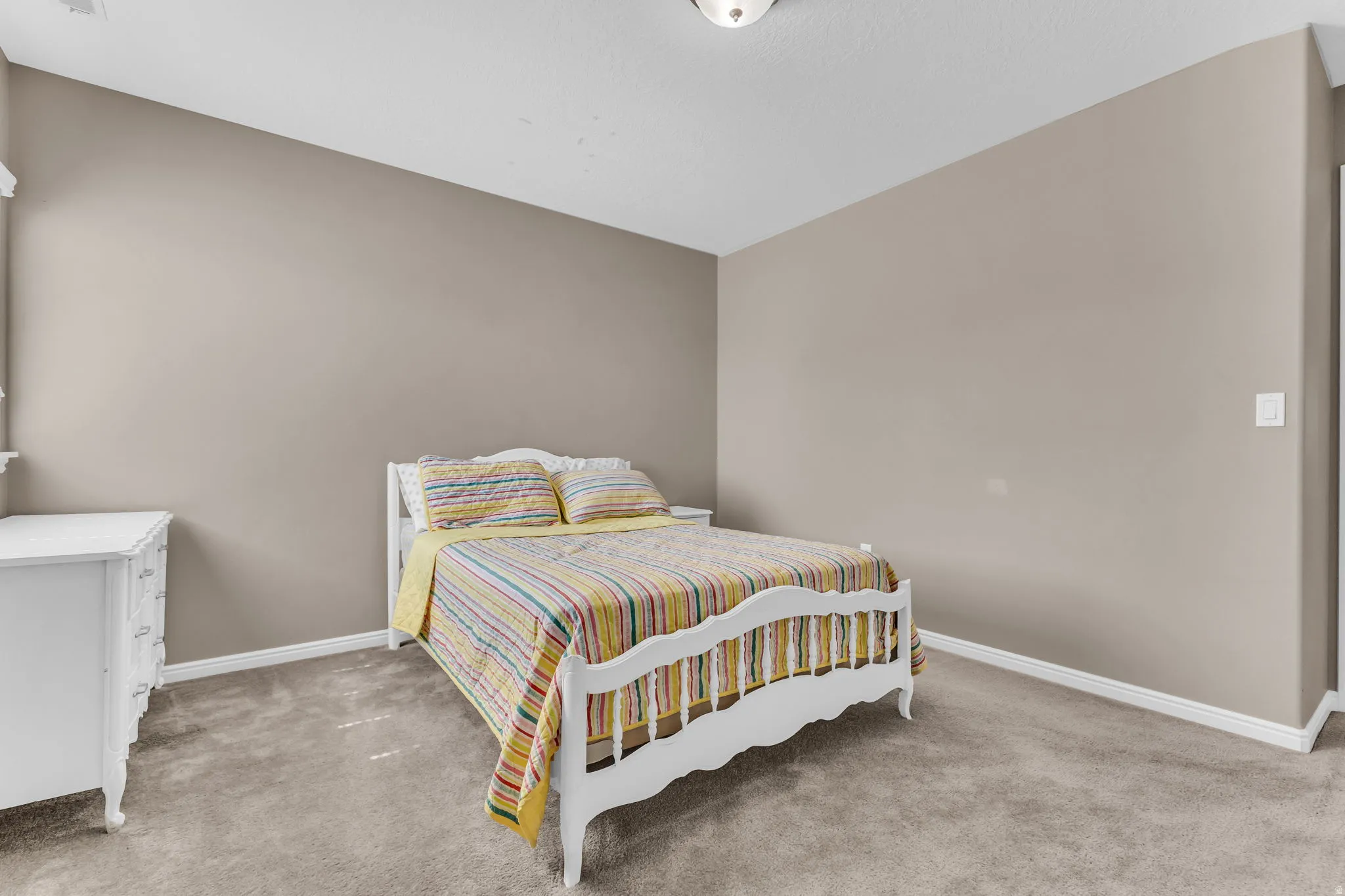 Neutral wall color, wall-to-wall carpeting, and white trim