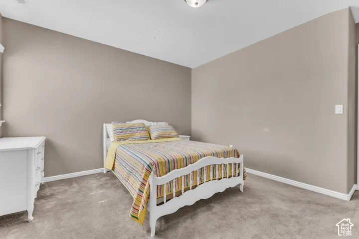 Neutral wall color, wall-to-wall carpeting, and white trim