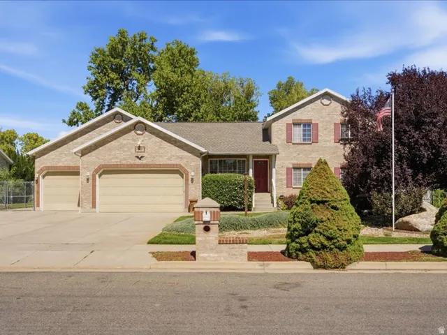 Brick exterior with a multi-car garage
