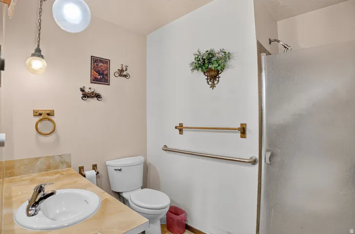 Vanity with an integrated sink and a stone-finish countertop