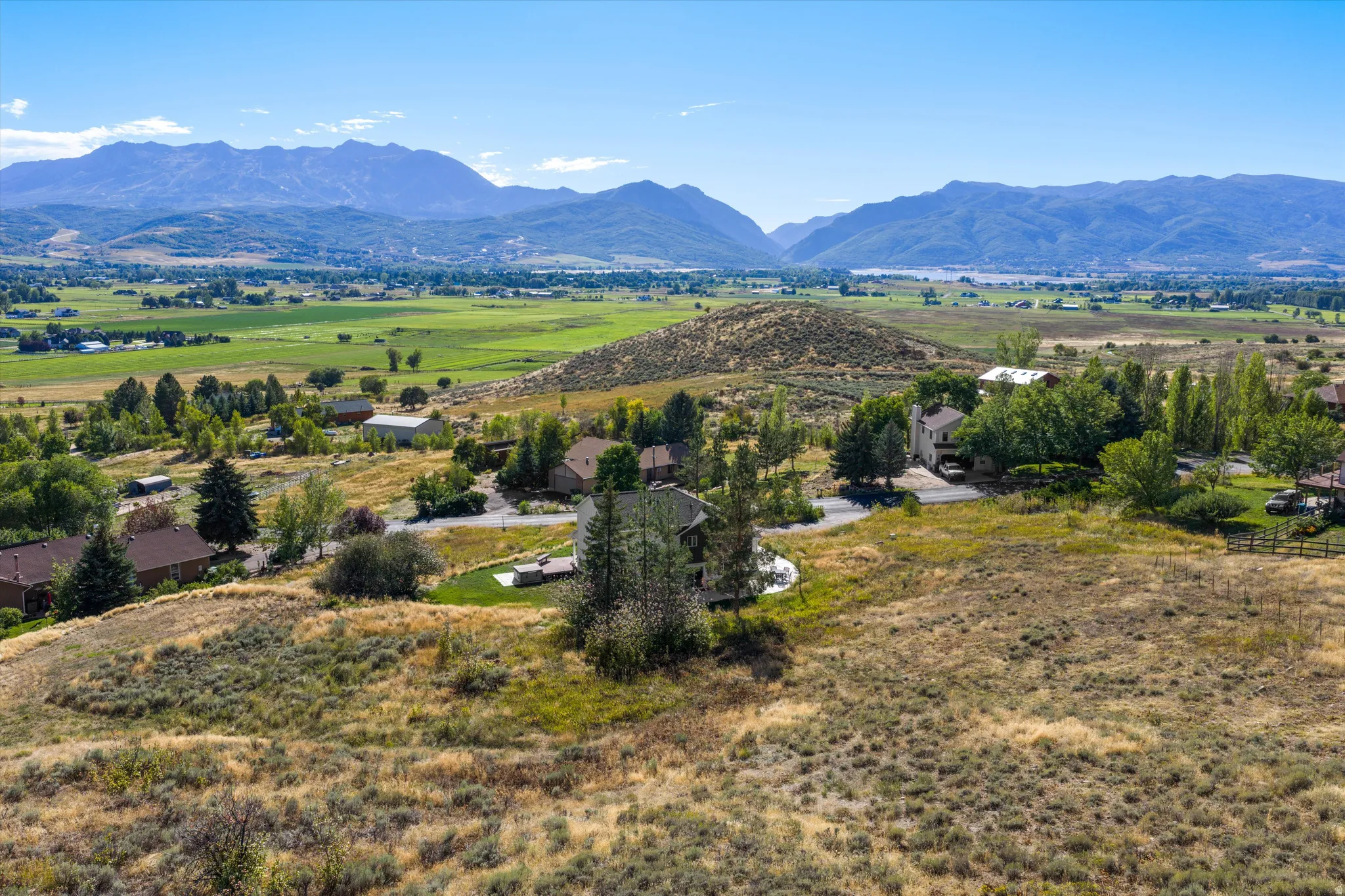 Expansive rural landscape featuring distant mountains and valleys