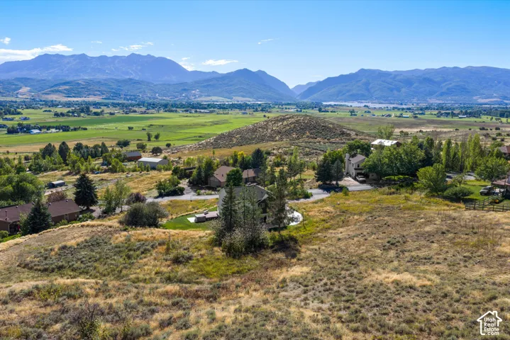 Expansive rural landscape featuring distant mountains and valleys
