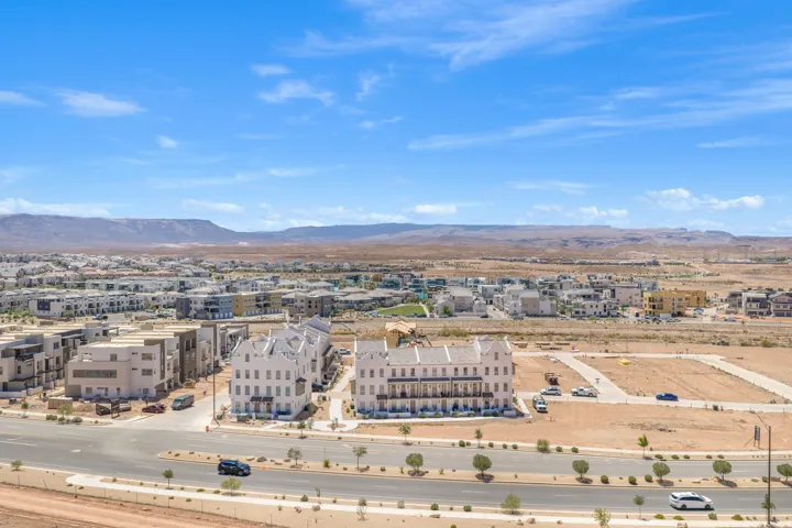 Modern community development featuring varied architectural styles and desert mountain backdrop