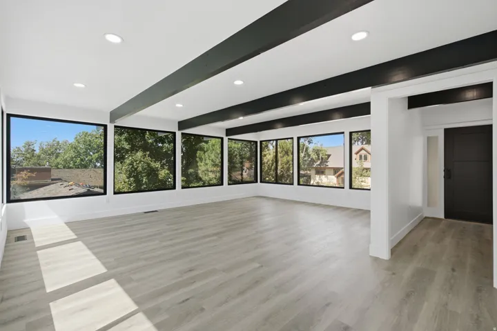 Natural light flows through multiple picture windows