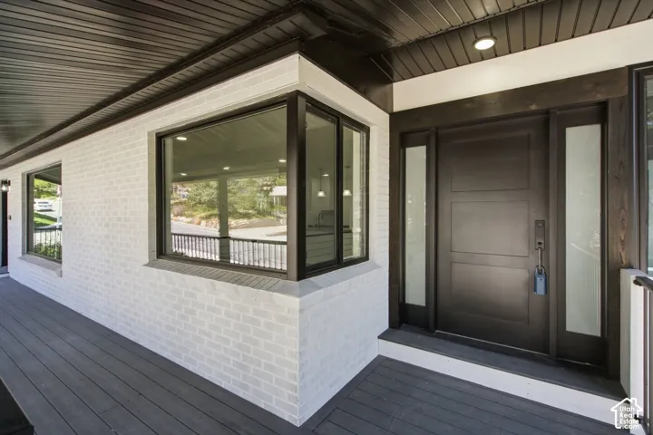 White brick exterior with modern dark trim accents