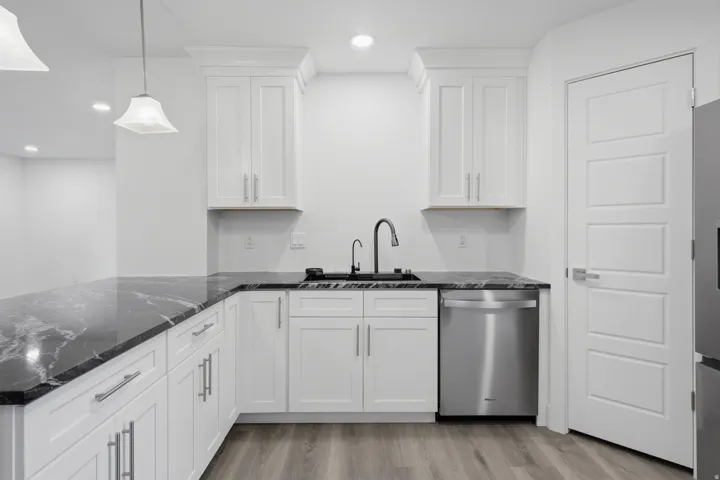 Marble countertops and decorative pendant lighting