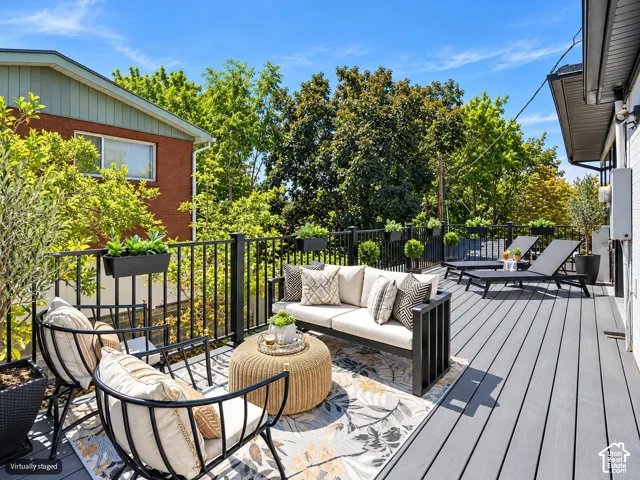 Elevated deck featuring composite decking and black metal railing