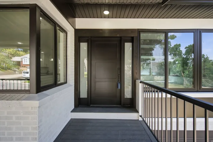 Modern entry with solid wooden door