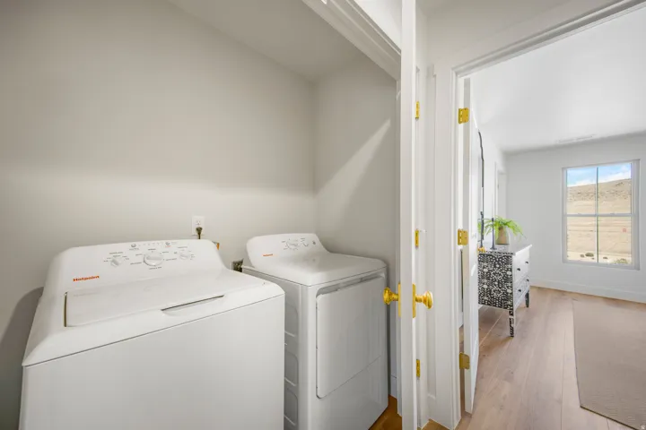 Dedicated laundry area with light gray walls