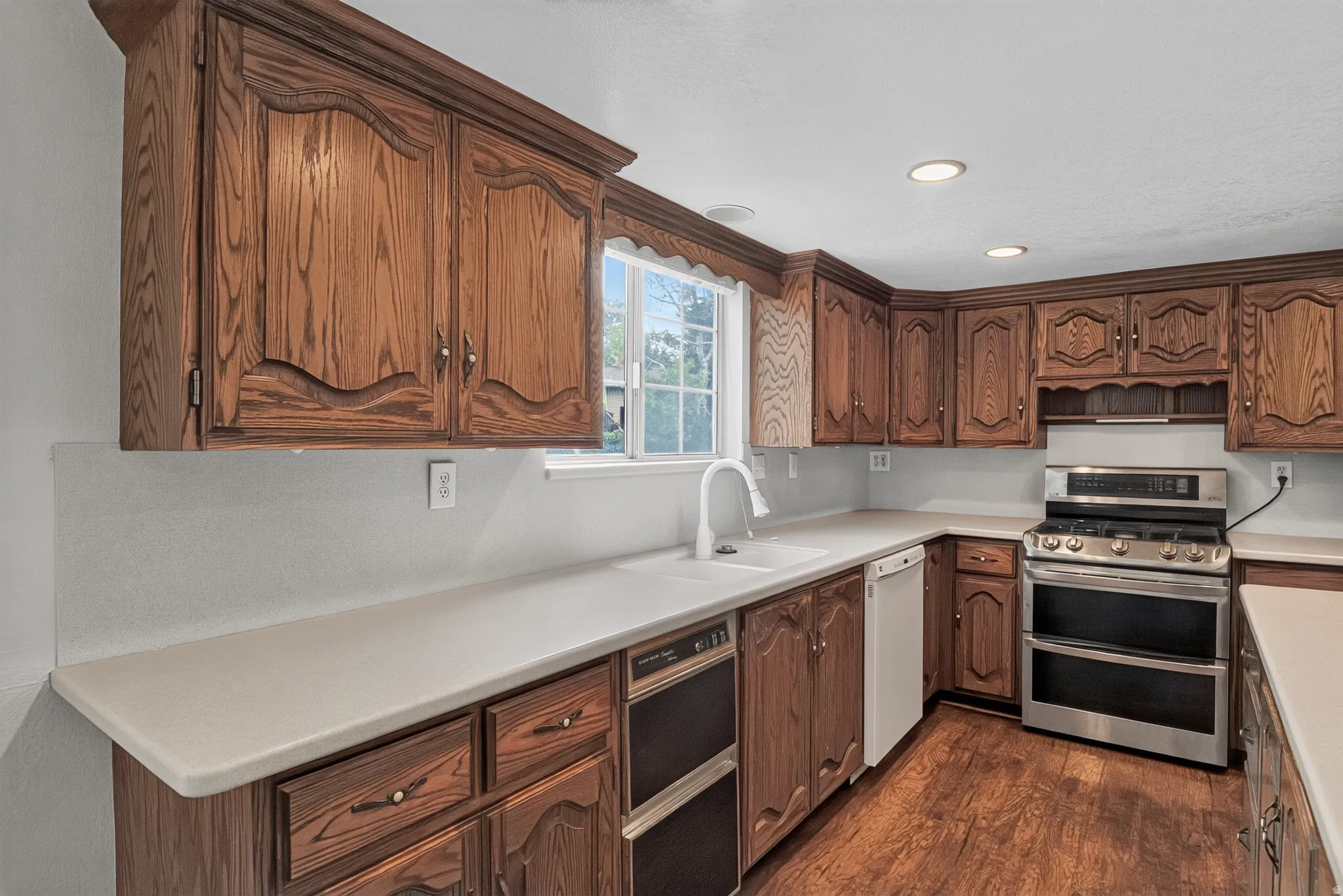 Wood-finish flooring, recessed lighting, double oven range