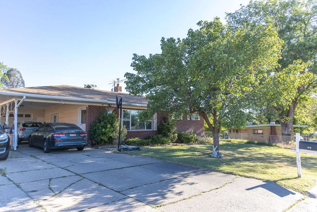 Brick exterior with a covered carport