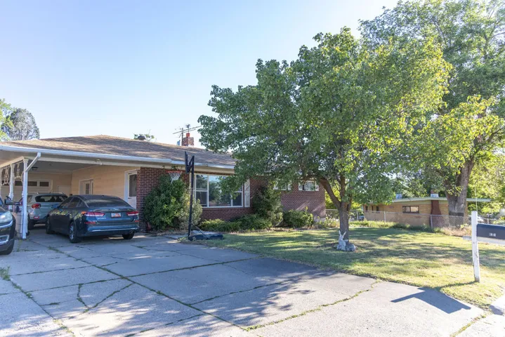 Brick exterior with a covered carport