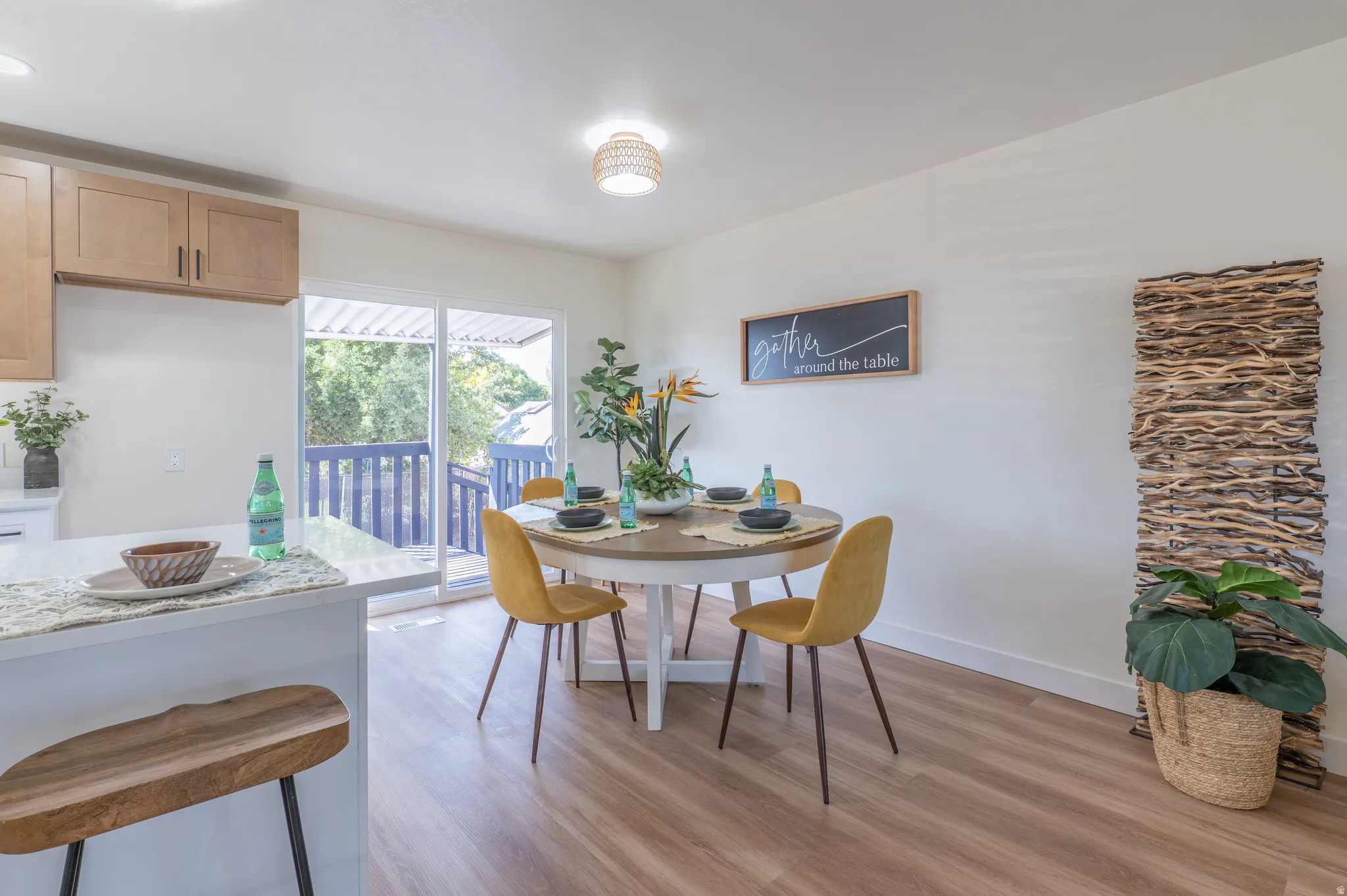 Open-concept dining area with wood-finish flooring
