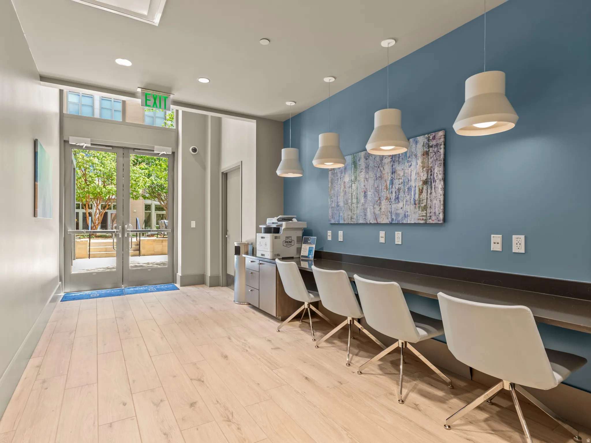 Wood-finish flooring with a contrasting blue accent wall