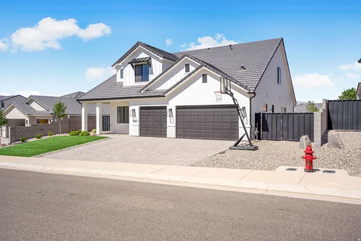 Contemporary exterior with white stucco and vertical siding accents