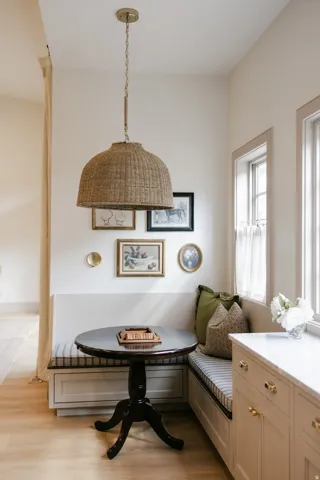 Built-in banquette seating with integrated storage, wood-finish flooring, and a woven pendant light fixture