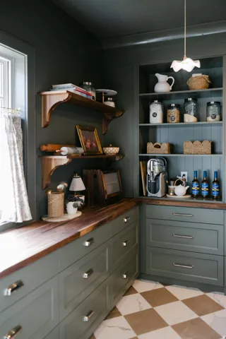 Built-in cabinetry with wood-finish countertops, open shelving, and checkerboard floor tiling